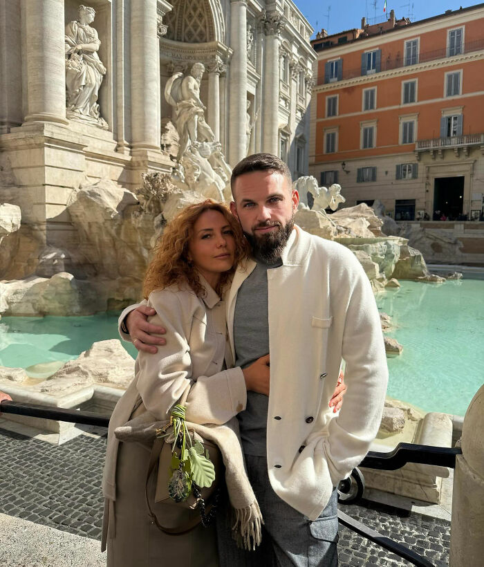 Couple posing by historic fountain, representing tragic story of crypto scammer found dismembered in Dubai mall case. Couple posing by historic fountain, representing tragic story of crypto scammer found dismembered in Dubai mall case.