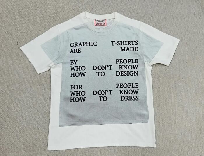 White T-shirt with unusual printed text design, featuring a trippy and artistic style resembling another reality.