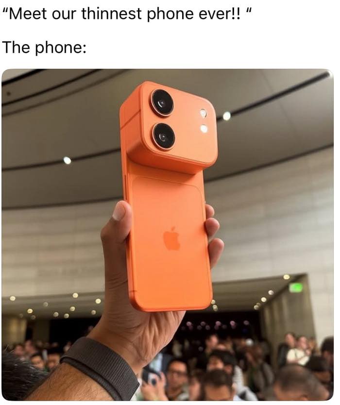 Hand holding an orange bulky phone with oversized camera lenses, humorously contrasting thin phone claims sarcasm post.