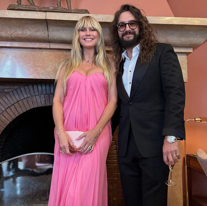 Heidi Klum and Tom Kaulitz posing indoors, dressed elegantly during their St Barths getaway.