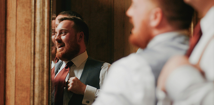 Groom adjusting tie and smiling nervously before wedding ceremony during couple split at altar unexpected revelations. Groom adjusting tie and smiling nervously before wedding ceremony during couple split at altar unexpected revelations.