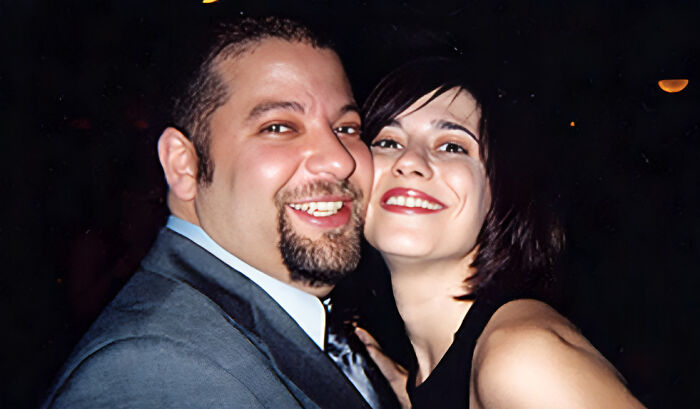 A smiling couple posing closely together, capturing a moment amidst unsolved mysteries people continue discussing.