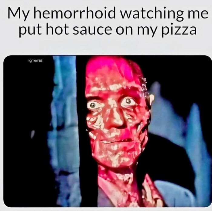 Close-up of a shocked red-faced character in a dark setting, a popular movie meme about spicy food pain.