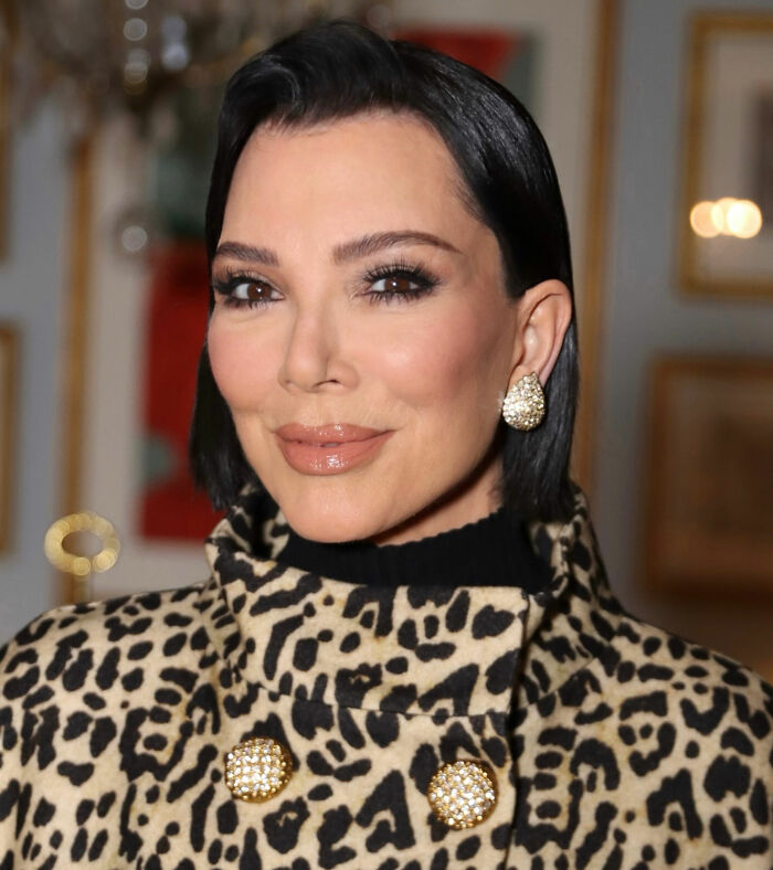 Kris Jenner without gloves in public, showcasing her hands after viral $100k facelift in a leopard print coat.
