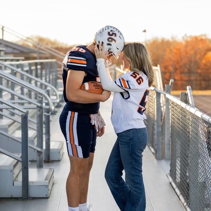 Mother and son in matching football jerseys share a tender moment in a photoshoot sparking parenting debate online.