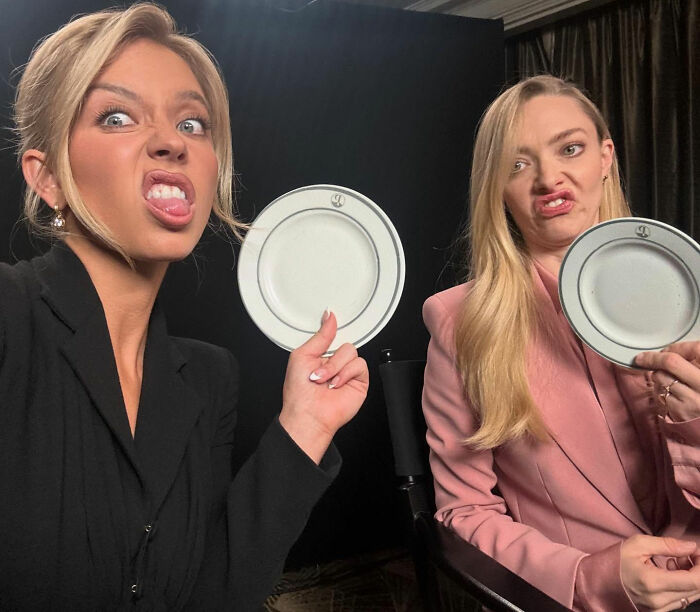 Two women making funny faces holding white plates, related to Sydney Sweeney lie detector test controversy.