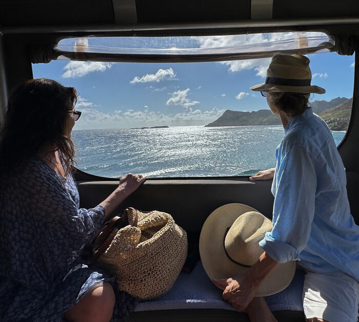 Two people looking out a window at the ocean, representing Rob Reiner's daughter before finding parents slain in LA home. Two people looking out a window at the ocean, representing Rob Reiner's daughter before finding parents slain in LA home.