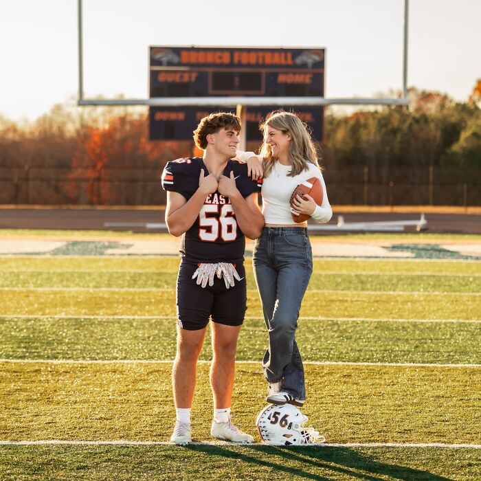 Mother and son posing on football field during photoshoot sparking viral debate about parenting and family boundaries.