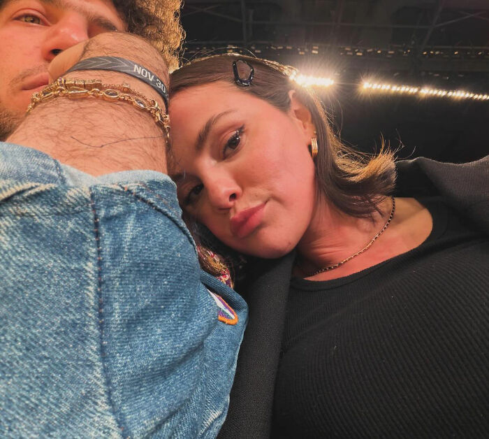 Selena Gomez close-up selfie with a fan, showing her response to questions about how she shaves her mustache.