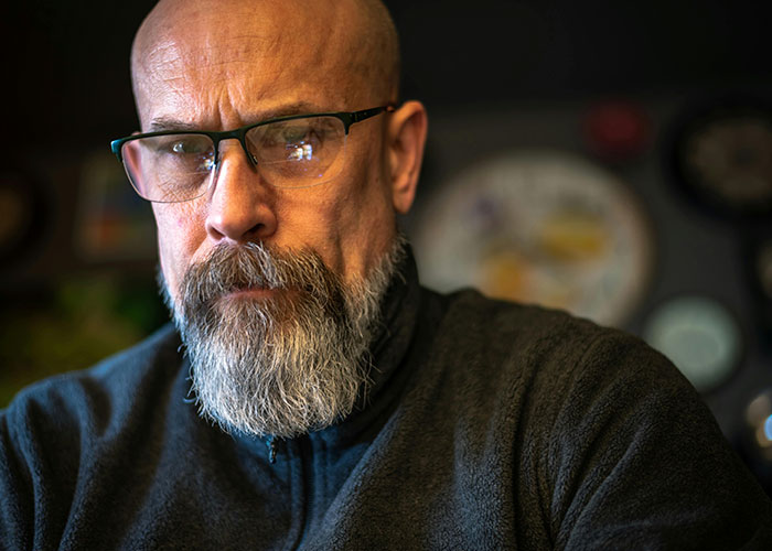 Middle-aged man with glasses and beard looking shocked, reflecting the unhinged things their MIL just said to them.