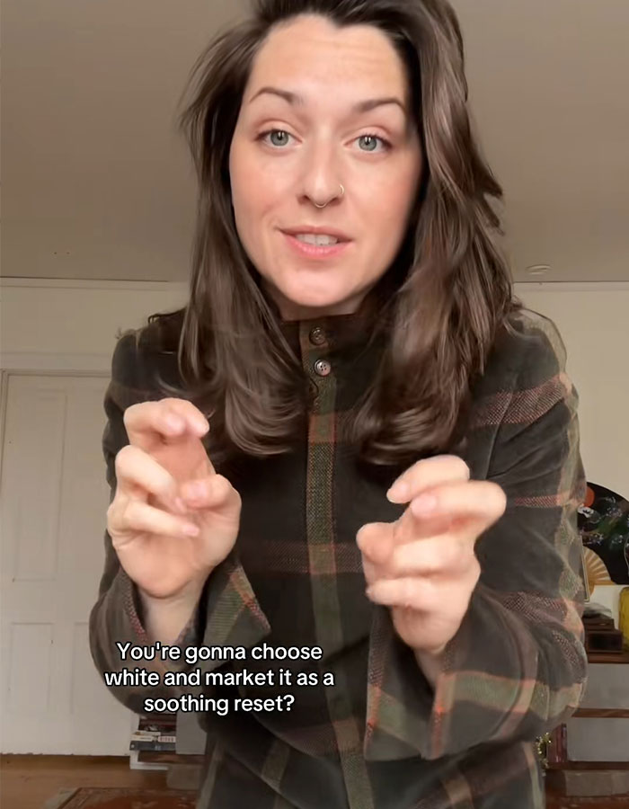 Woman in a plaid shirt speaking about Pantone&rsquo;s controversial Color of the Year sparking an online meltdown.