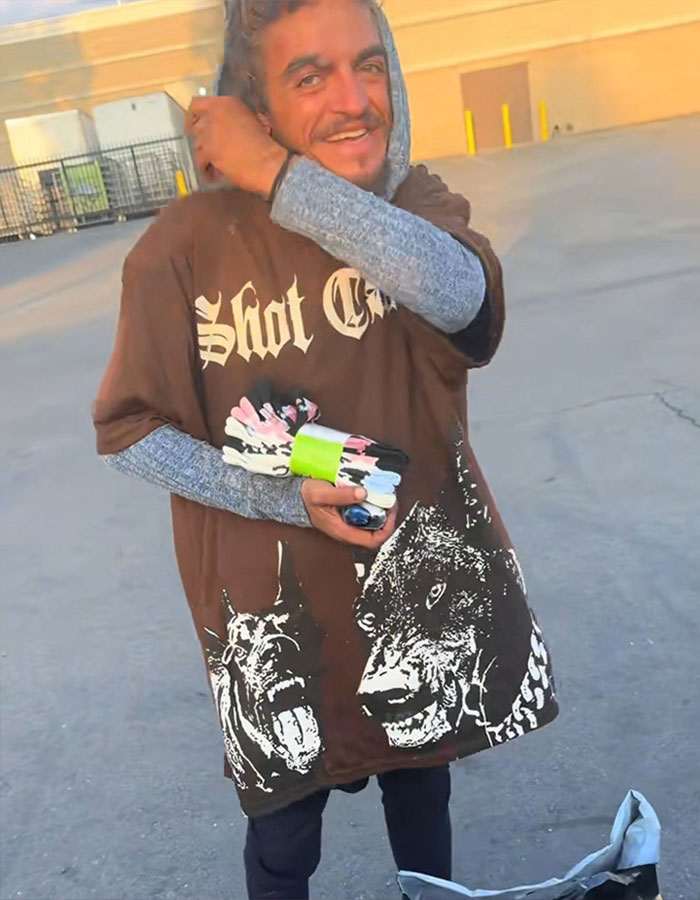 Man wearing a brown graphic shirt standing outdoors, highlighting dad of Nickelodeon star Tylor Chase with health update.