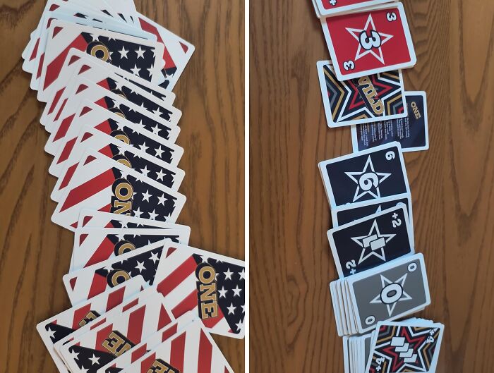 Playing a quirky card game with colorful, star-themed cards featuring patriotic red, white, and blue designs.