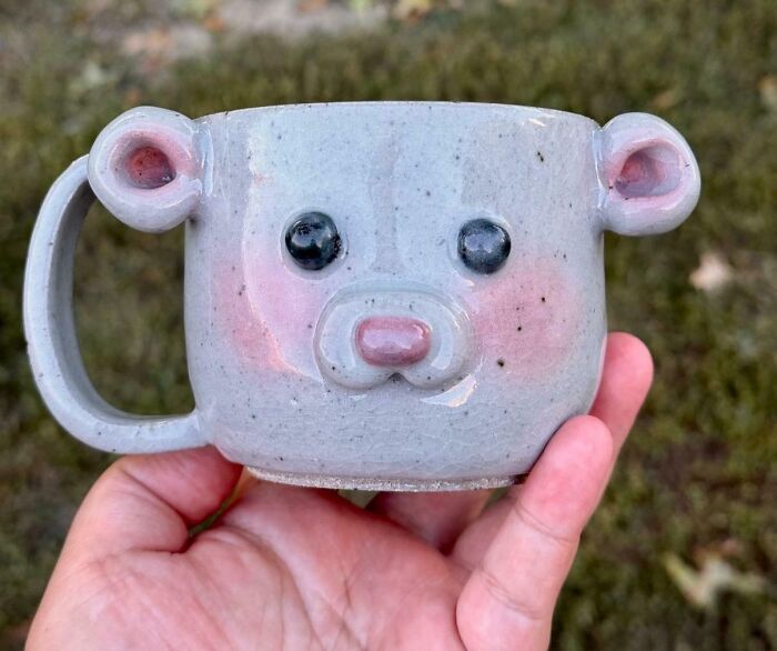 Handcrafted ceramic bear mug with cute ears and detailed face, one of the cool things people made to share.
