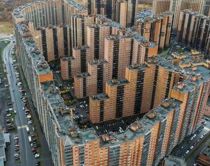 Aerial view of evil buildings with an ominous, fortress-like structure that looks straight out of horror movies.