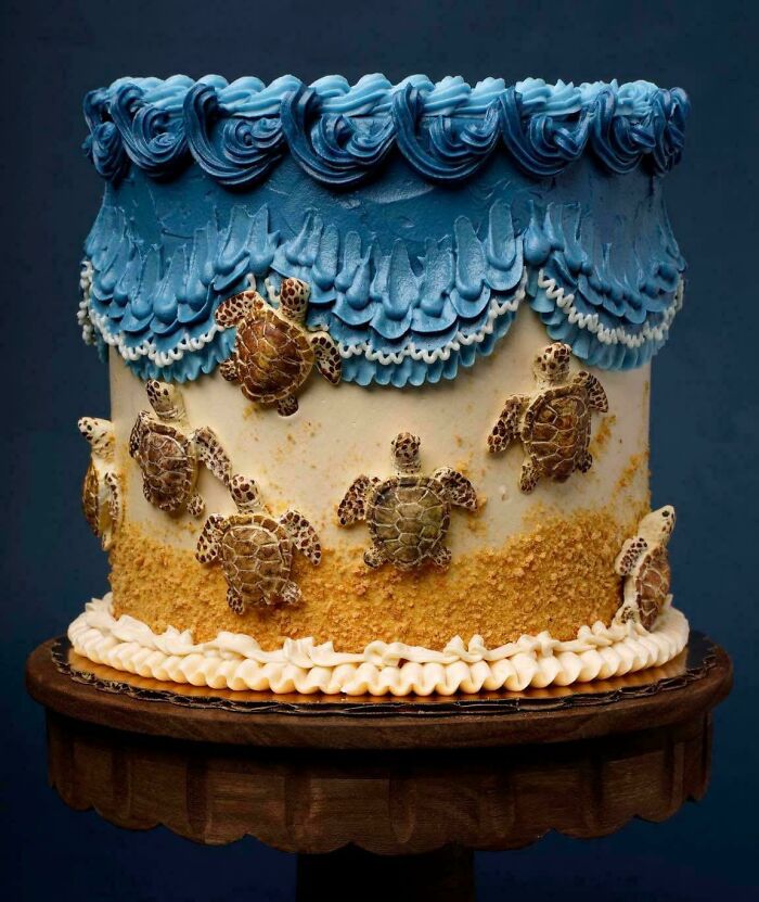 Ocean-themed cake with detailed sea turtle decorations and blue frosting, showcasing masterfully crafted cakes creativity.