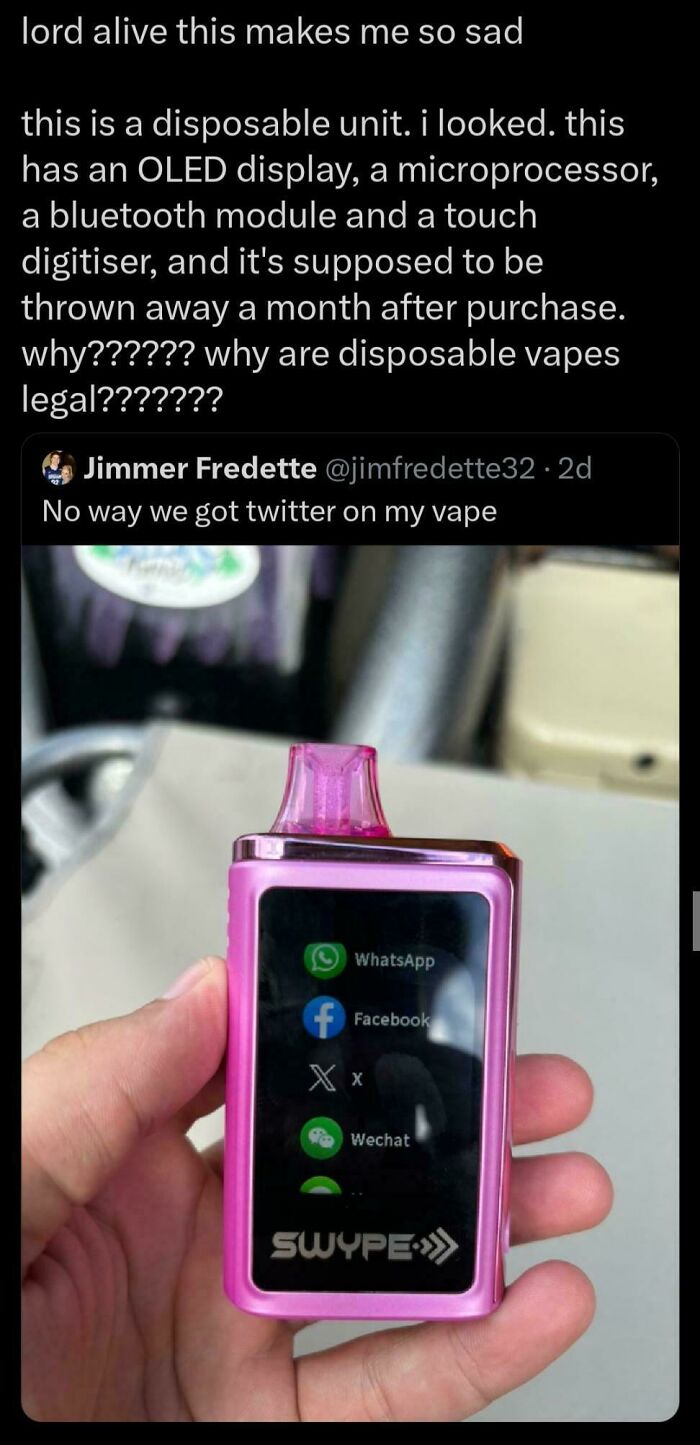 Hand holding a pink disposable vape with a digital screen showing social media apps reflecting sad uninspiring dystopia.