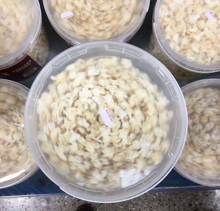 Buckets of popcorn appear to be spinning, creating a confusing visual effect that challenges perception.