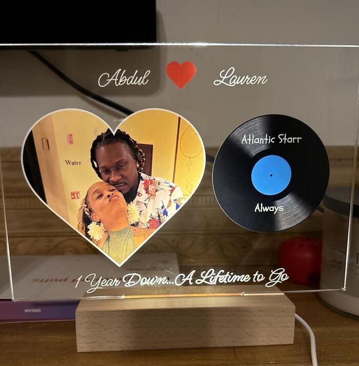 Personalized custom gift with a photo heart and vinyl record design, showcasing a romantic anniversary message.