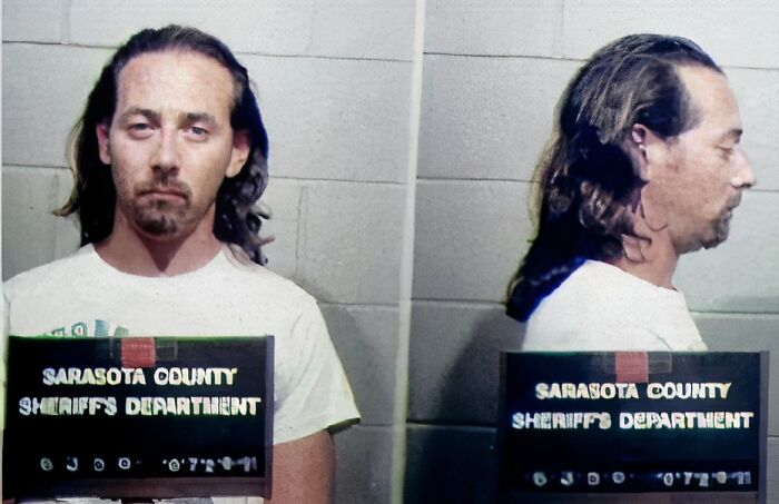 Mugshot of a male celeb with long hair taken by Sarasota County Sheriff's Department after arrest.