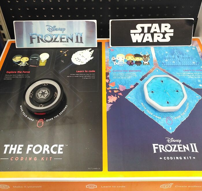 Frozen II and Star Wars coding kits with sensors and interactive features poorly arranged on a retail display for job fail humor.