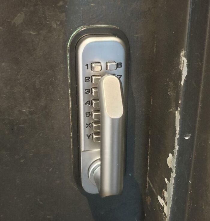 Lock with misplaced handle covering keypad numbers, showing job done poorly and confusing to use.