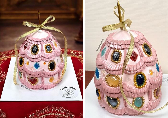 Intricately crafted pink cake decorated with colorful edible gems and gold accents, showcasing masterful cake creativity.