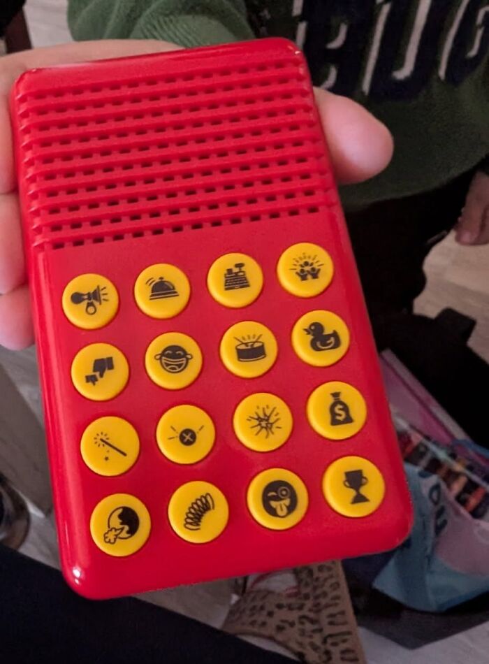 Red sound effects gadget with yellow buttons featuring playful icons, a perfect gag gift for friends who dislike scented candles.
