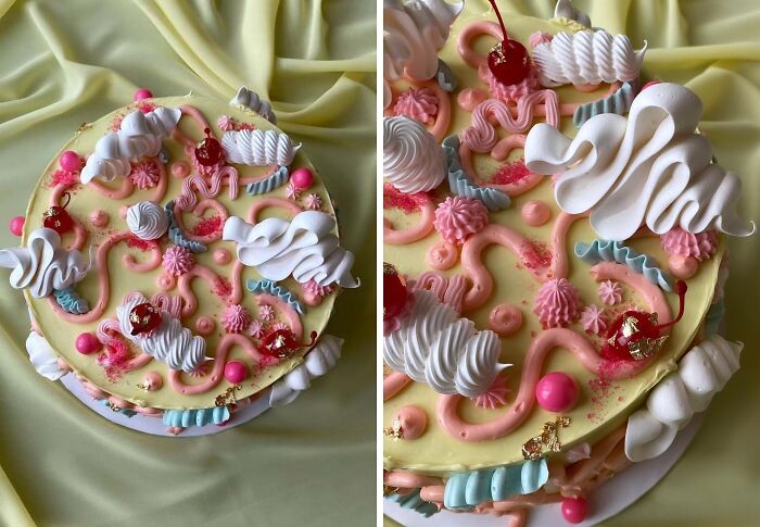 Colorful masterfully crafted cake decorated with pink, white, and blue frosting swirls and cherries on a yellow fabric backdrop