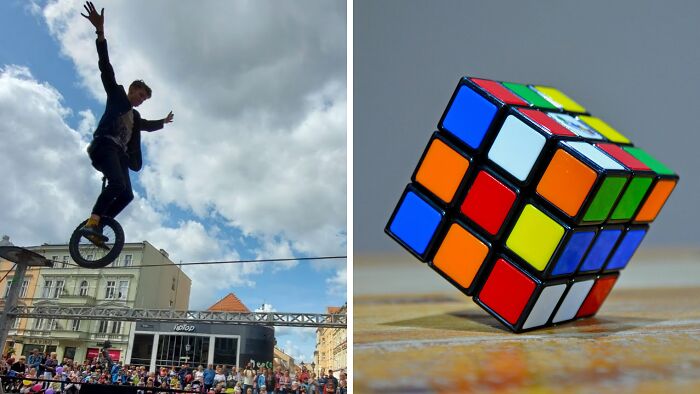 Person balancing on a unicycle high above a crowd beside a colorful Rubik's Cube puzzle on a table, showing public speaking dilemma.