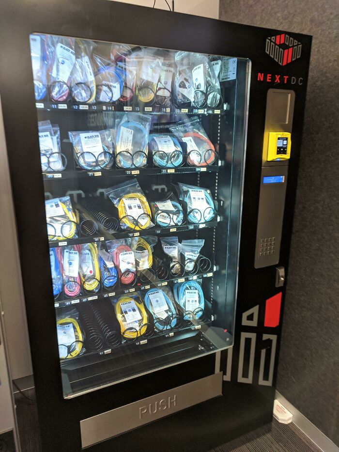 Vending machine stocked with various cables and accessories, showcasing unique job-related items for a 9-to-5 workday.