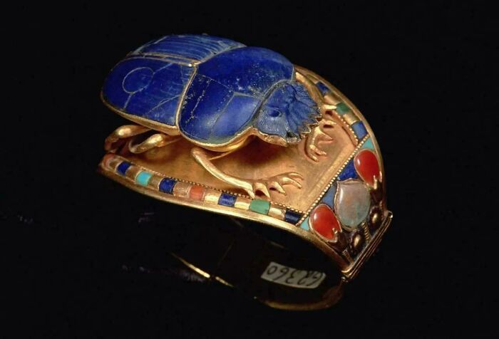 Ancient Egypt scarab ring with lapis lazuli and colorful stones showcasing incredible craftsmanship and symbolism.
