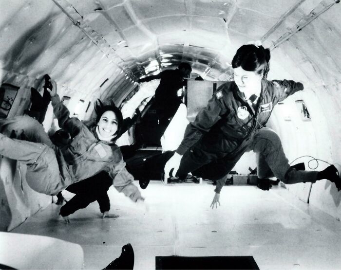Women in a zero-gravity training exercise inside an aircraft, showcasing unique and fascinating jobs beyond the typical 9-to-5.