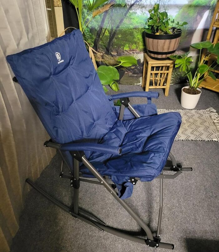 Blue cushioned rocking chair in a cozy indoor space with plants, perfect gift ideas for mother-in-law.