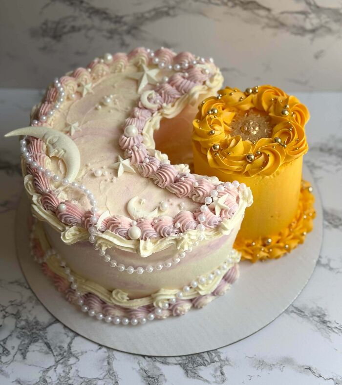 Two masterfully crafted cakes with intricate frosting and decorative pearls showcasing creativity in cake design.