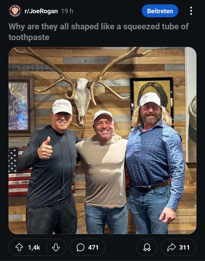 Three men posing indoors with hats and a mounted deer skull behind them, showcasing epic burns and insults.