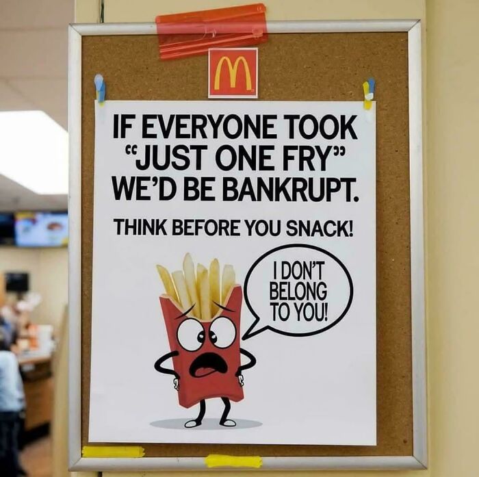 McDonald’s sign with a cartoon fries box saying "I don’t belong to you" warning against taking just one fry to avoid bankruptcy.