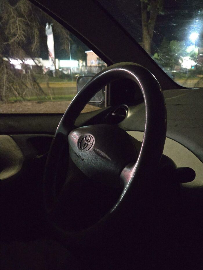 Steering wheel inside a dark car at night, symbolizing rental nightmares where landlords cut corners and got exposed.