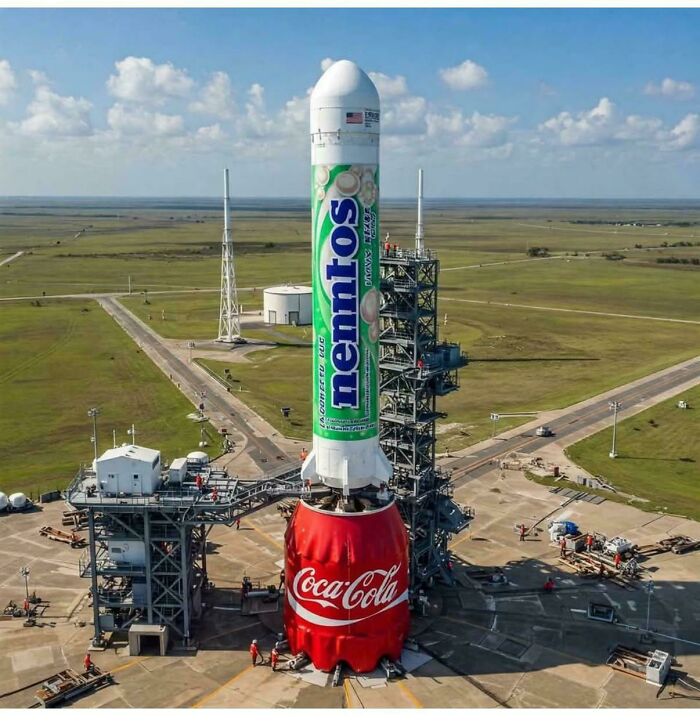Rocket launch pad with a large Mentos and Coca-Cola rocket, illustrating a weird math problem concept.