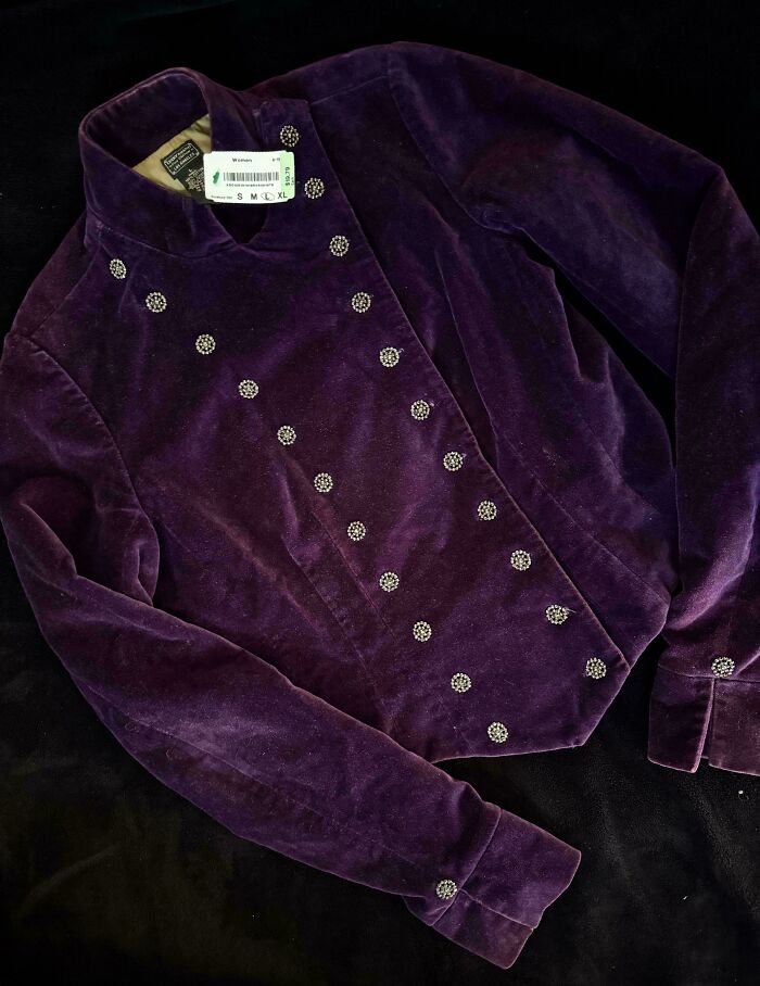 Vintage purple velvet jacket with ornate buttons found in secondhand stores delivering cool, unexpected surprises.