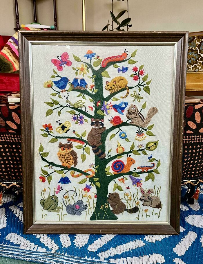 Framed embroidered artwork of a tree with colorful animals and insects found in secondhand stores cool surprises.