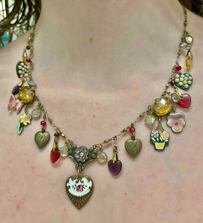 Vintage heart charm necklace found at a secondhand store, showcasing cool and unexpected jewelry surprises.
