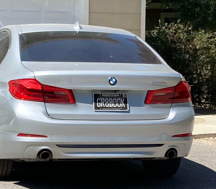 Silver BMW with an Arizona personalized license plate reading GROBOOK, an example of hilarious personalized license plates.