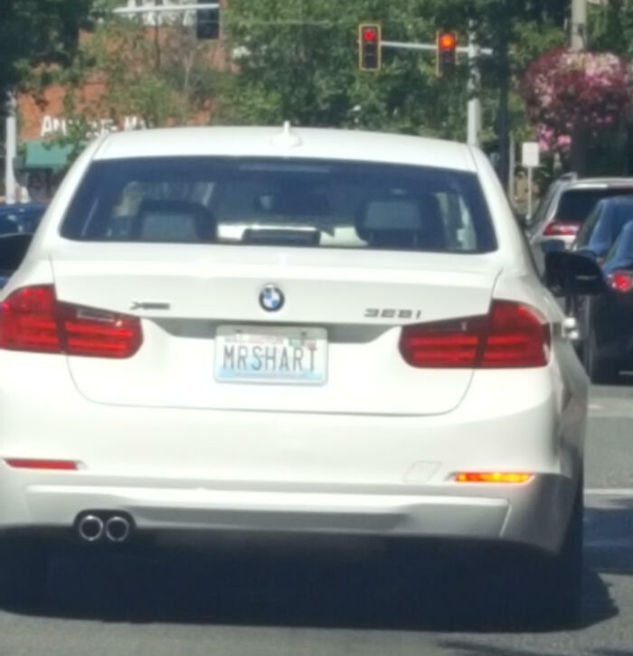 White BMW with a personalized license plate reading MRSHART, part of hilarious personalized license plates making strangers do double takes