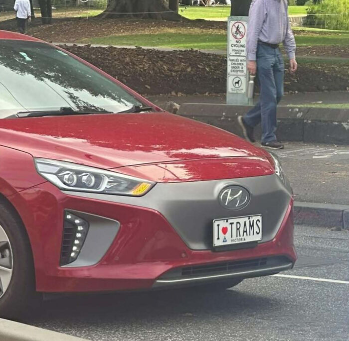 Red Hyundai car with a personalized license plate reading I heart trams, showing hilarious license plates.