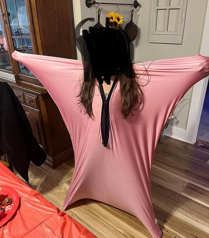 Child wearing a stretchy pink sensory suit, demonstrating one of the gifts that unleash 5-year-old joy and fun.