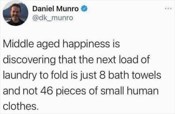 Tweet about middle-aged dad happiness found in small laundry tasks, capturing funny and wholesome dad moments.