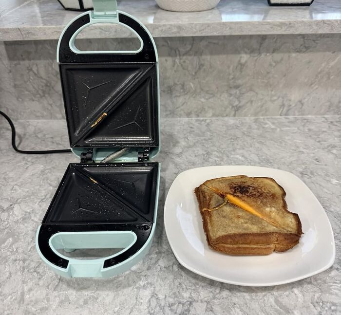 The Sad, Room-Temperature Sandwich You Packed For Lunch Can Now Be Transformed Into A Hot, Toasty, And Deeply Satisfying Pocket Of Melted Cheese And Happiness With A Mini Sandwich Maker 