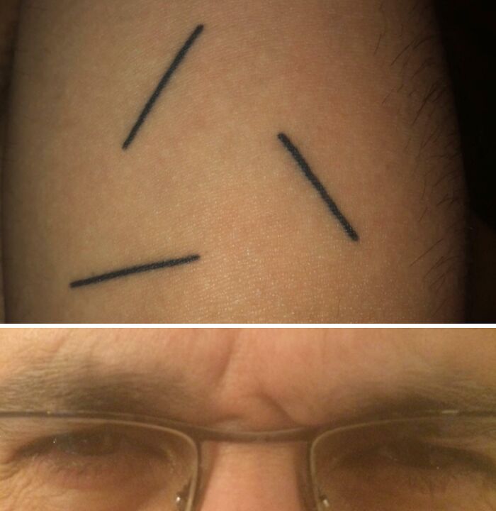 Minimalist wholesome tattoo with three short black lines on skin, showcasing meaningful little ink design.