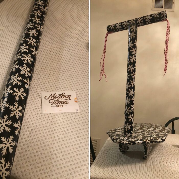 Gift wrap creatively disguised as a snowflake-patterned wheelbarrow, showcasing funny Christmas gift wraps inspiration.